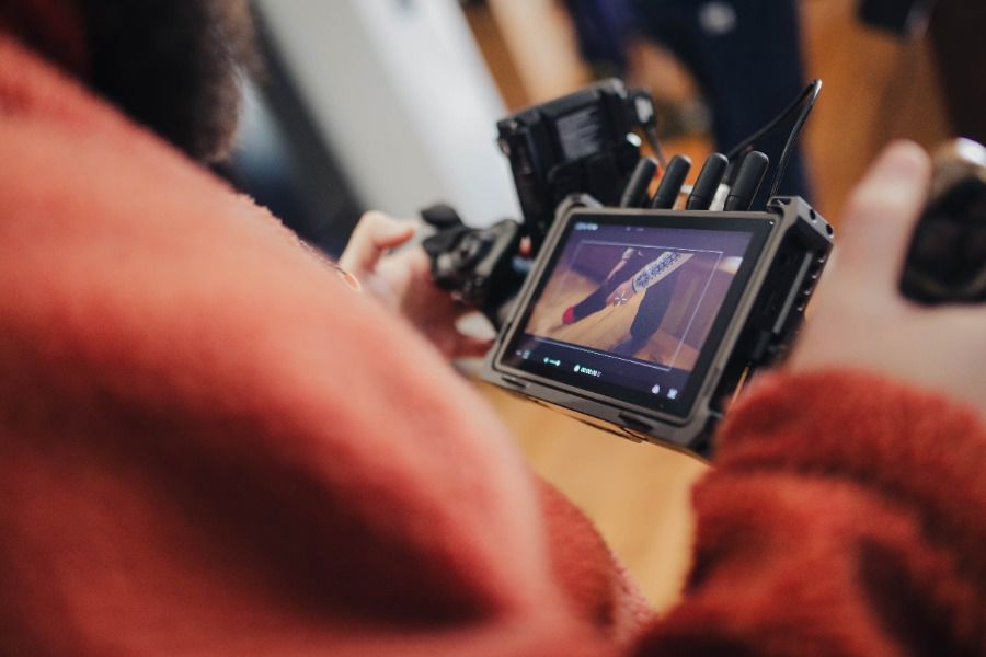 A close-up shot of a camera shooting video content